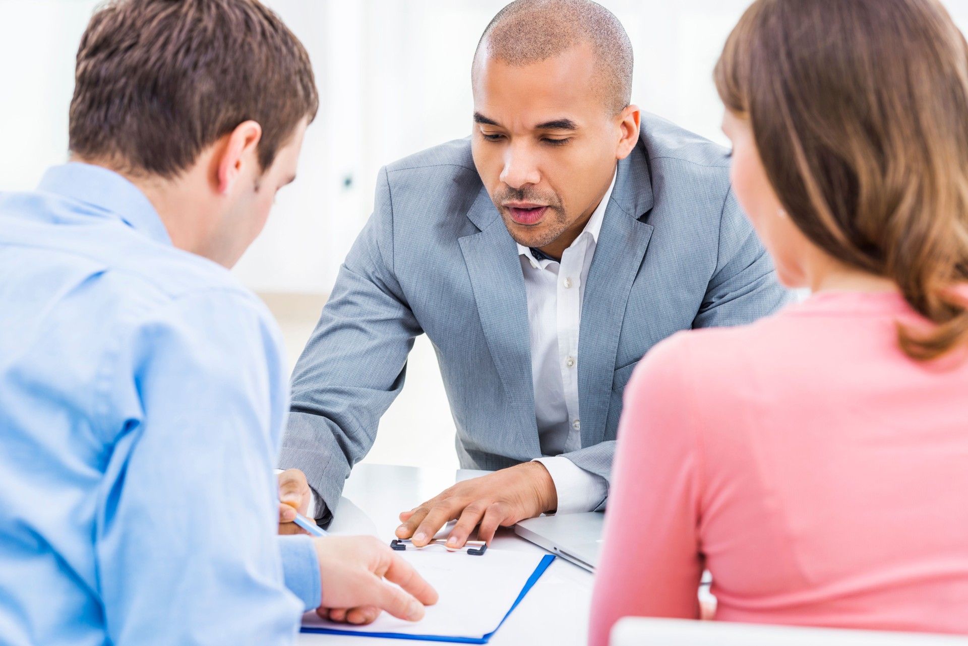 Couple meeting with their financial advisor.